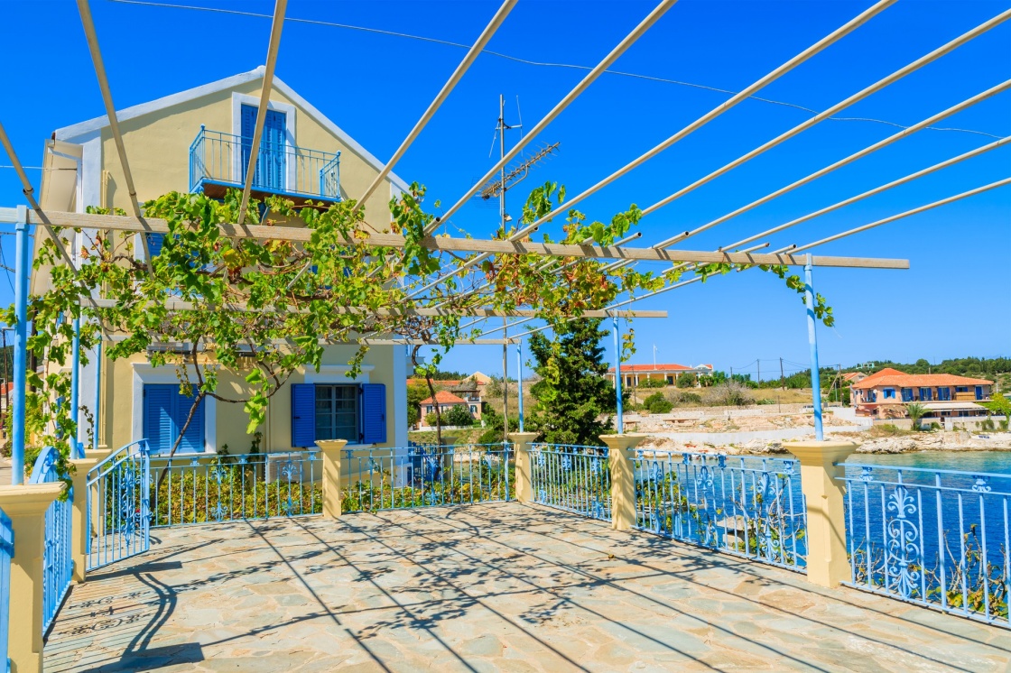 'Traditional greek house with vine growing on terrace in Fiskardo village, Kefalonia island, Greece' - Kefalonia